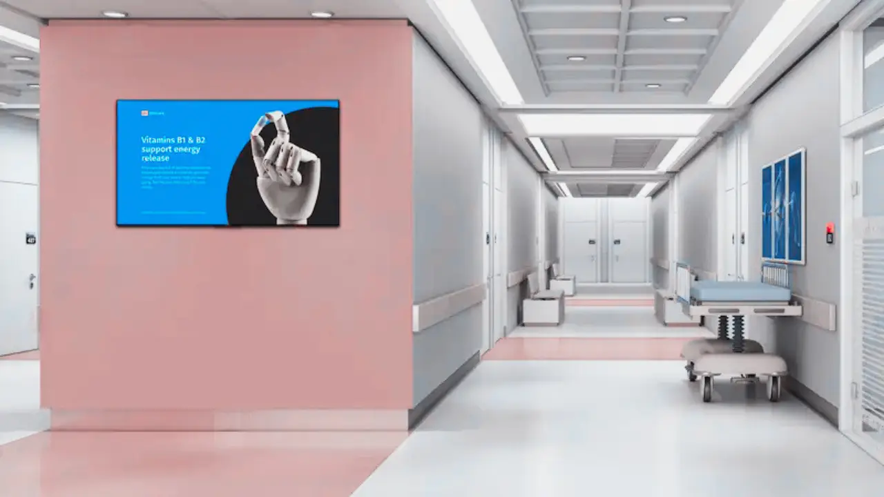 Digital signage wayfinding display in a hospital corridor helping visitors navigate departments
