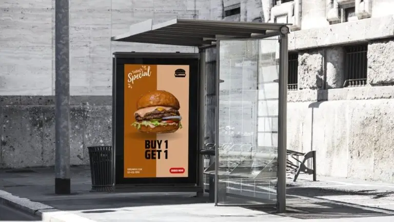 Digital bus shelter display advertising burger special promotion with Buy 1 Get 1 offer in urban transit environment