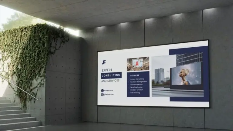 Outdoor digital signage display advertising expert consulting services mounted on concrete wall with green vine elements and stairway