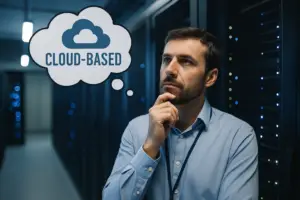 IT expert in server room thinking about switching to cloud-based digital signage solutions